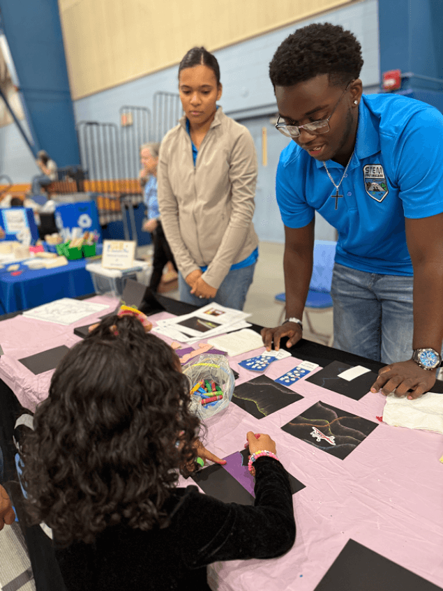 NIA STEM Student Ambassadors program participants engaging in educational activities.