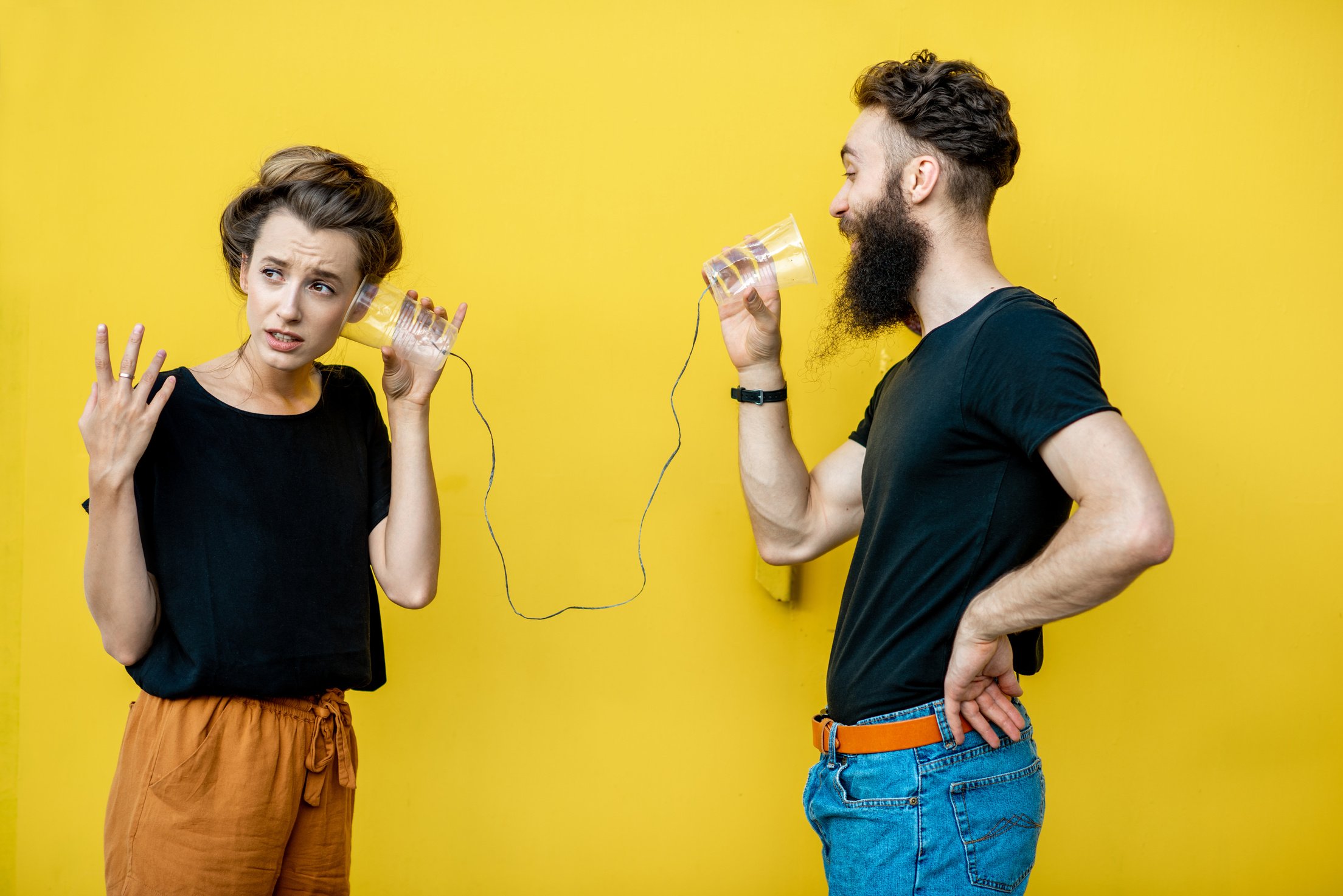 Man and Woman Talking with String Phone