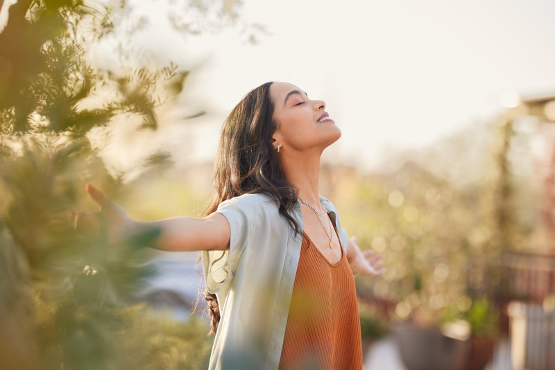 A person with arms outstretched, representing a fulfilling career path.