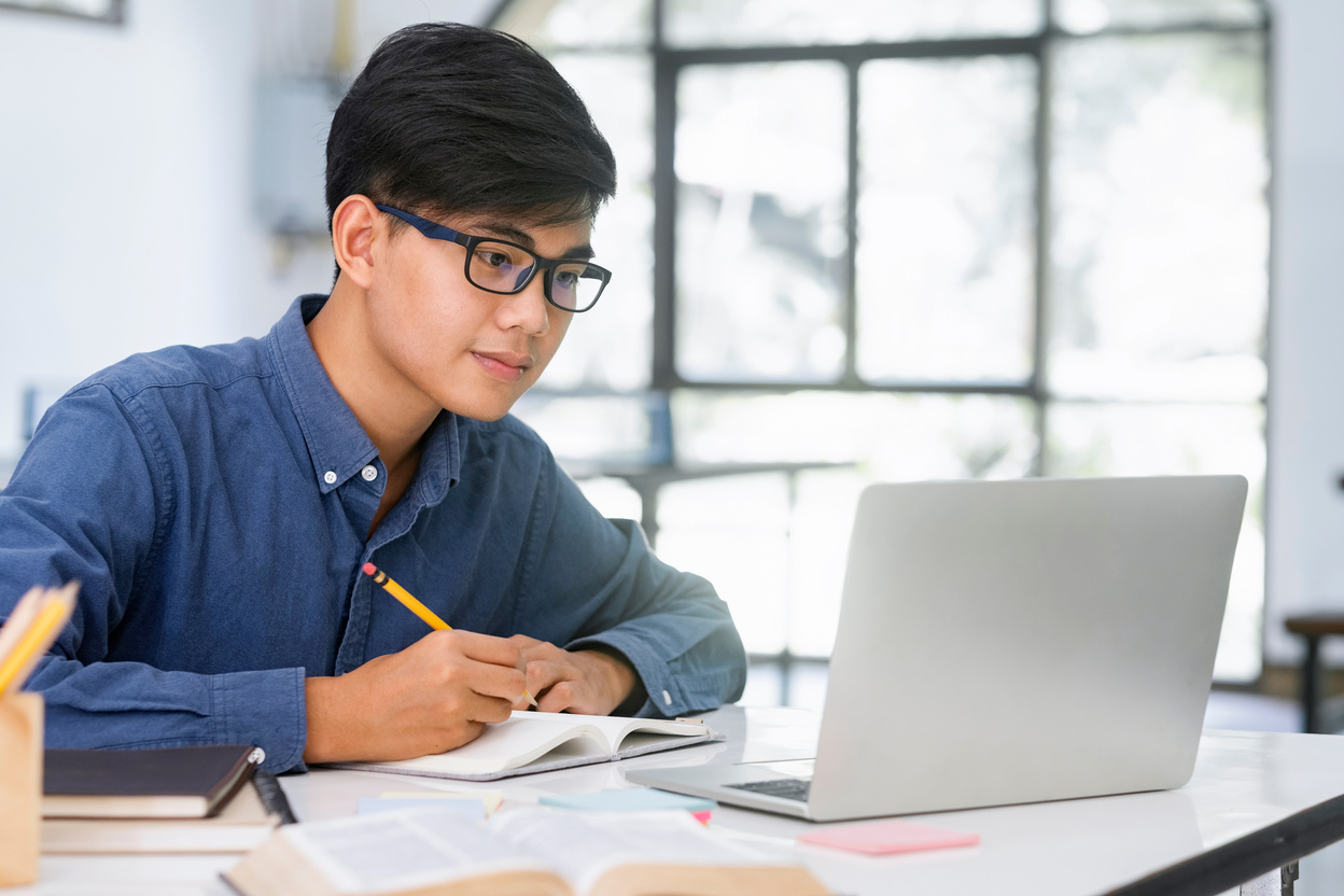 Young Man Learning Online 