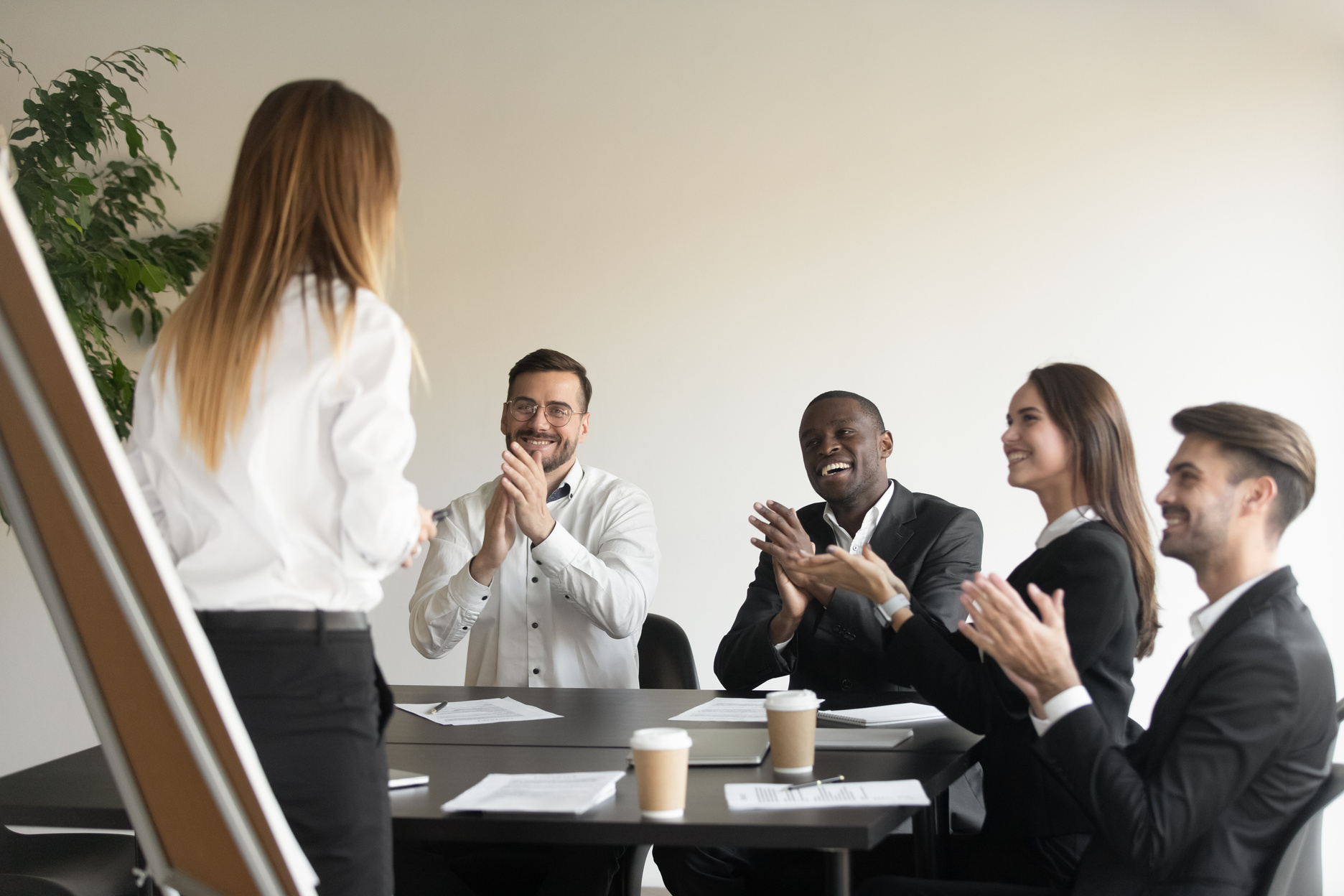 Employees clap hands showing respect and appreciation to business coach